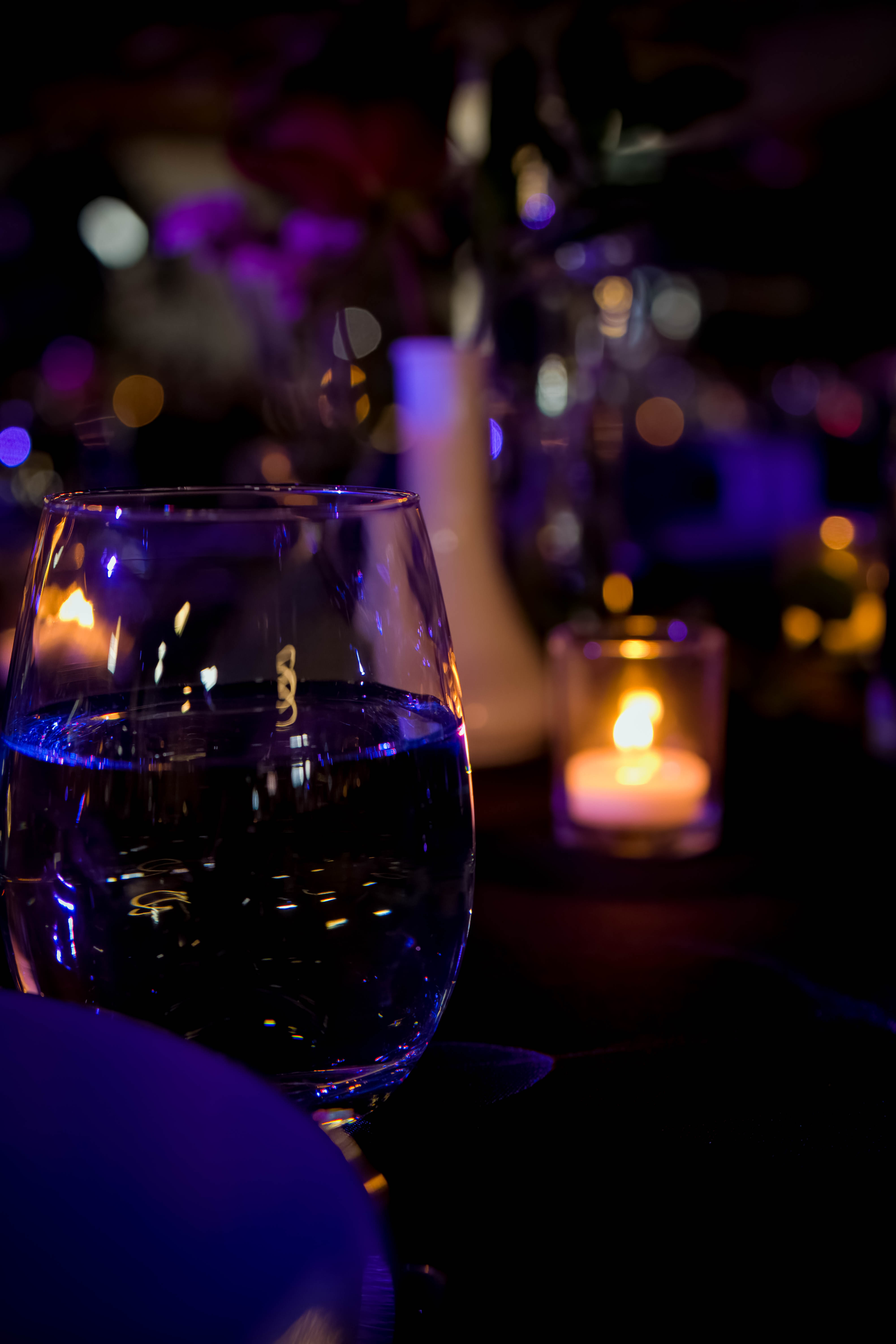 Corporate event — keynote speaker at podium in blue suit